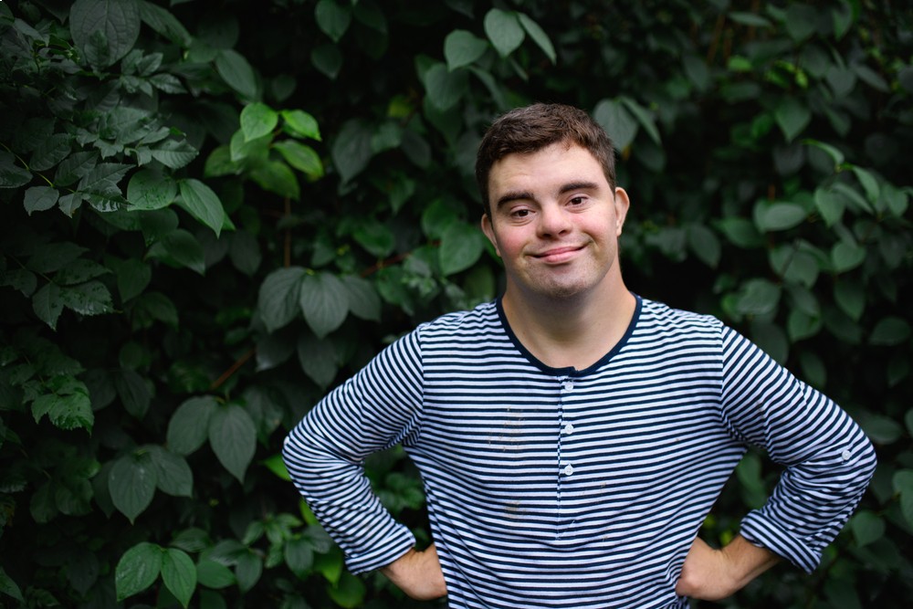 Disability client smiling in a Cairns garden.